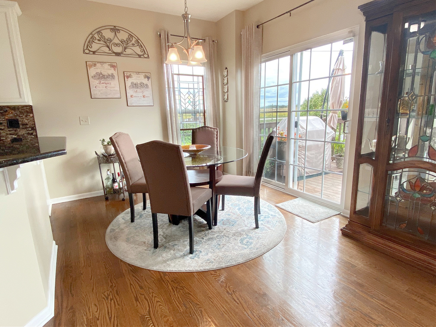 1197 Freedom Road Elburn, IL 60119 - Photo 5 of 31 a dining room with furniture a livingroom and wooden floor