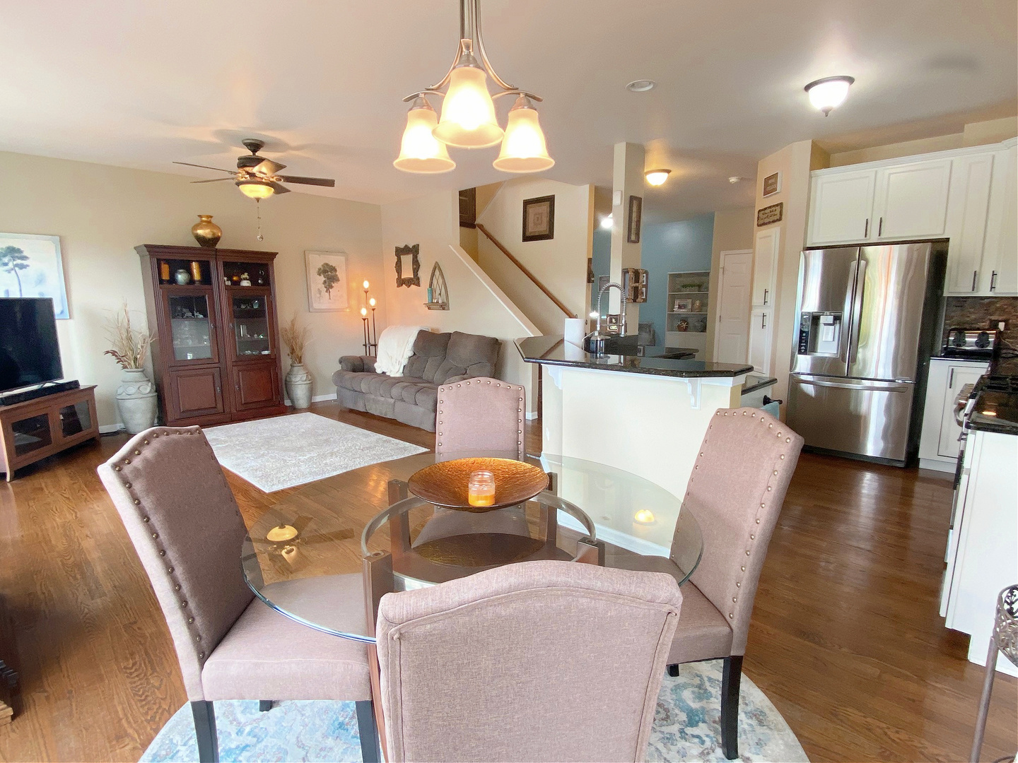 1197 Freedom Road Elburn, IL 60119 - Photo 7 of 31 a living room with furniture a dining table and a chandelier