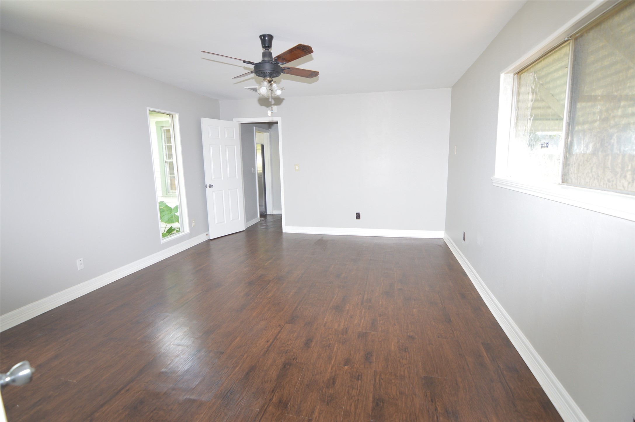 1403 Elton Street Houston, TX 77034 - Photo 11 of 21 wooden floor in an empty room with a window