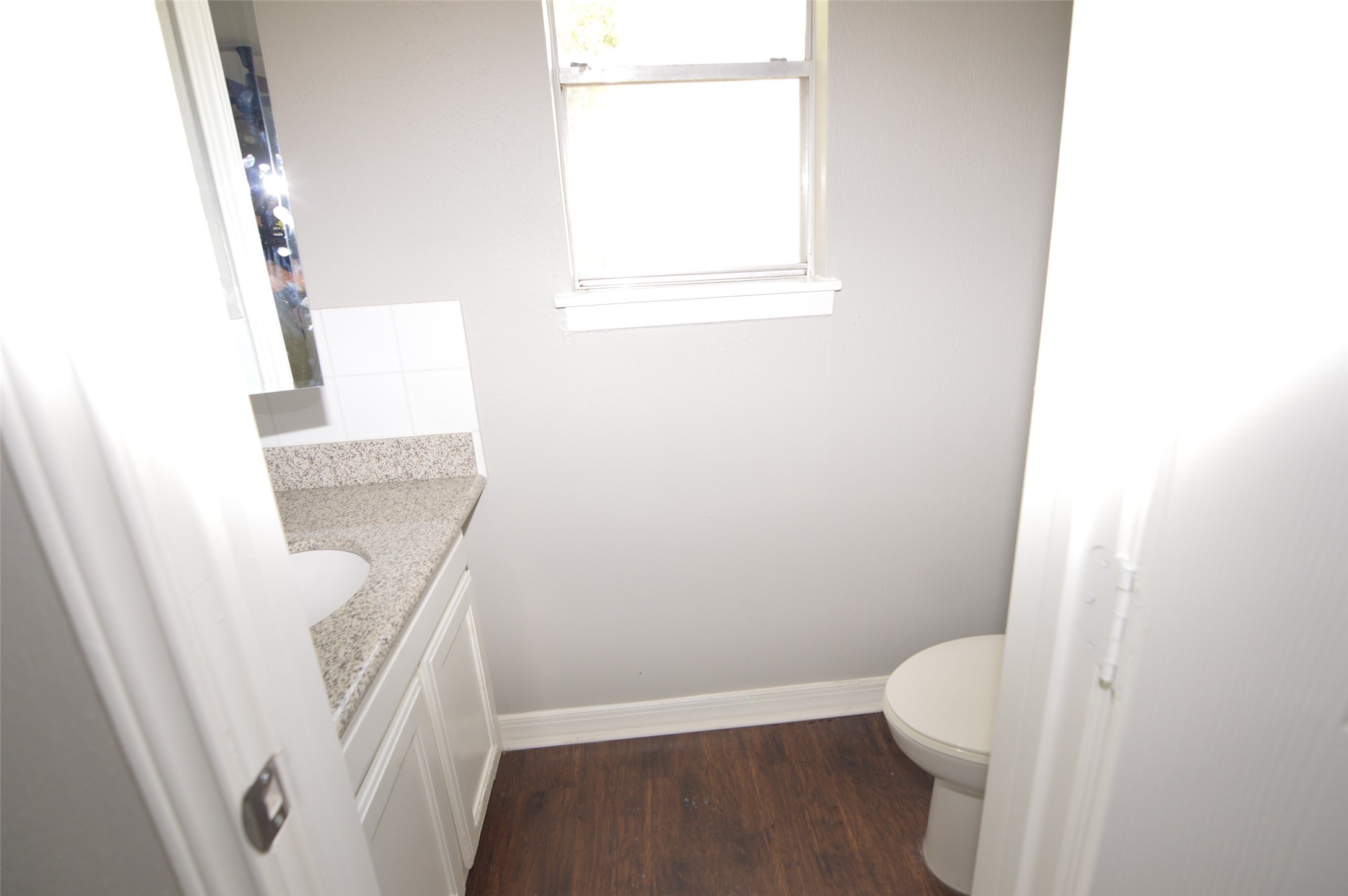 1403 Elton Street Houston, TX 77034 - Photo 12 of 21 a bathroom with a white toilet and a sink