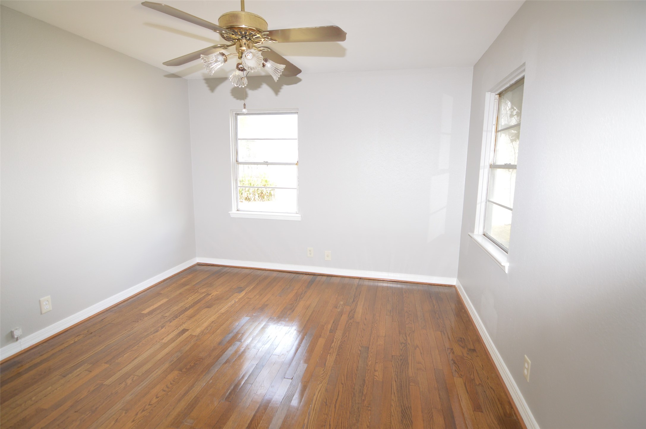 1403 Elton Street Houston, TX 77034 - Photo 16 of 21 wooden floor in an empty room with a window