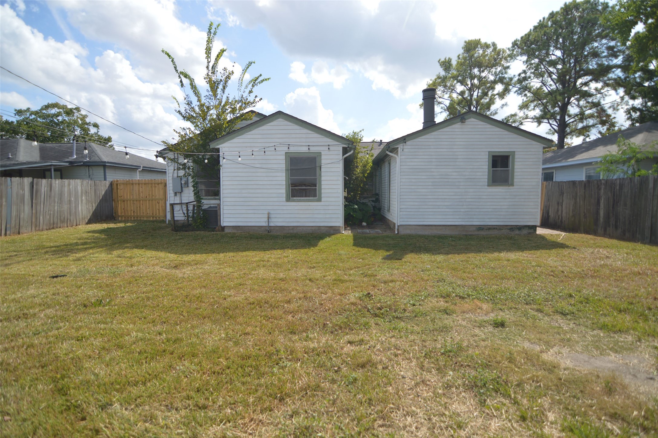 1403 Elton Street Houston, TX 77034 - Photo 19 of 21 a view of a house with a yard