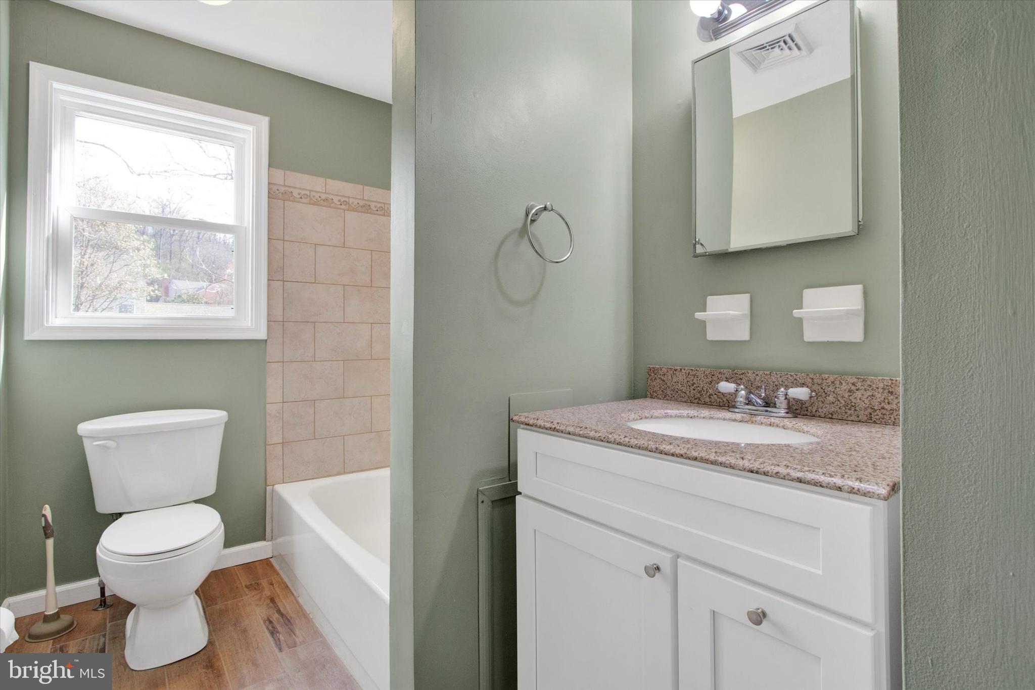 744 Tamarack Trail Reading, PA 19607 - Photo 14 of 27 a bathroom with a toilet sink and mirror