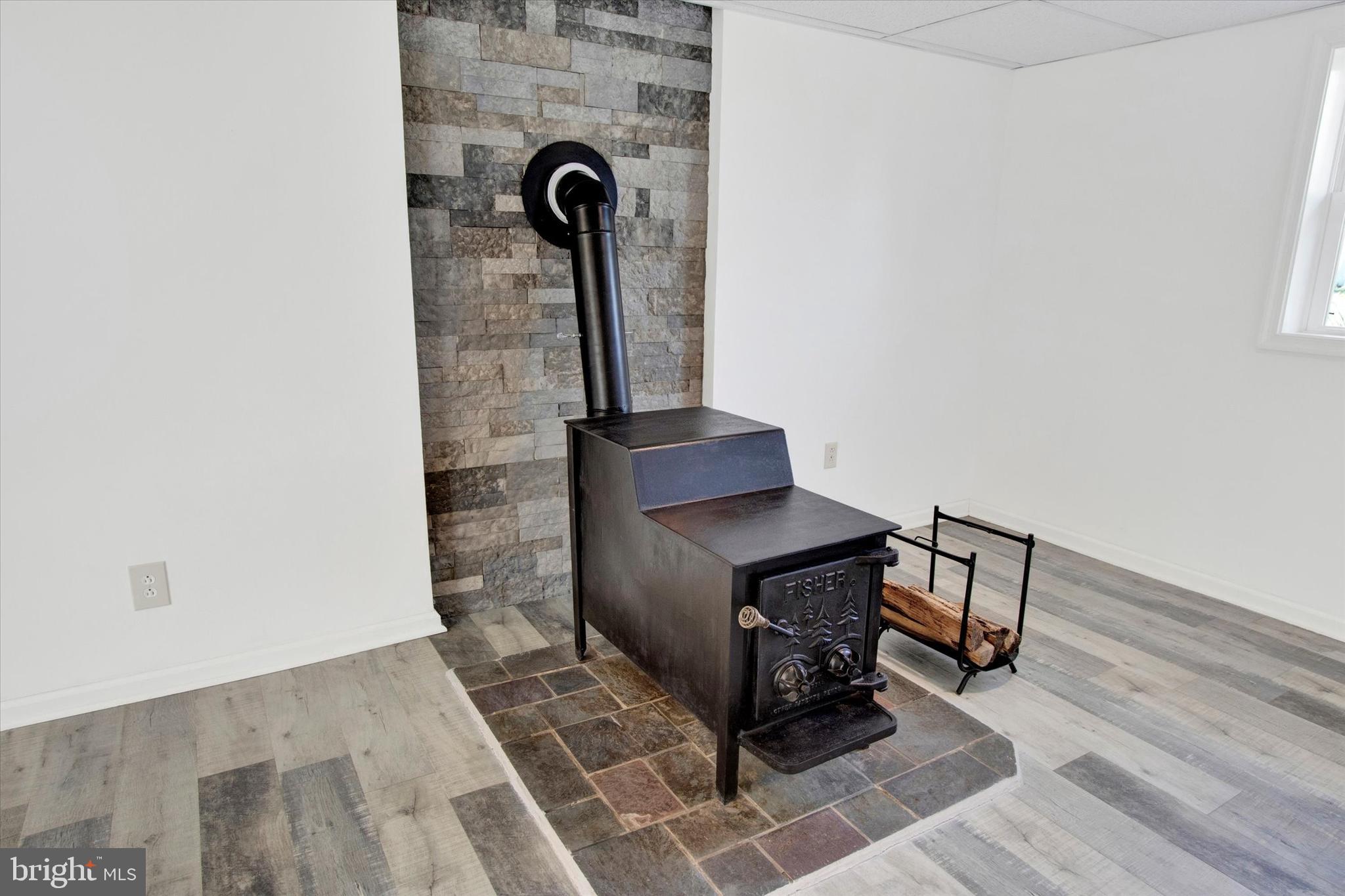 744 Tamarack Trail Reading, PA 19607 - Photo 15 of 27 a view of a hallway with wooden floor and a potted plant