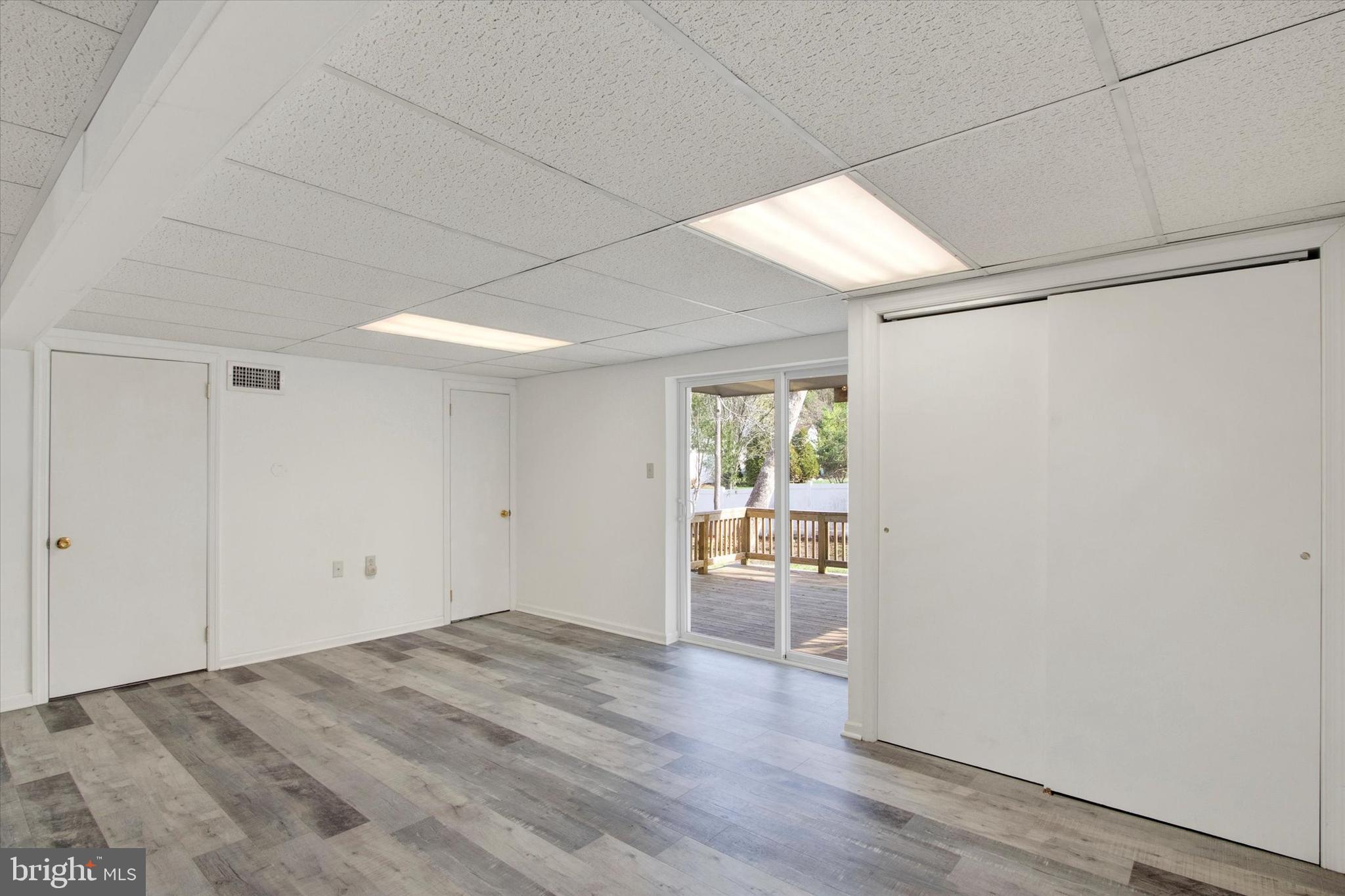 744 Tamarack Trail Reading, PA 19607 - Photo 17 of 27 a view of a room with wooden floor and a window