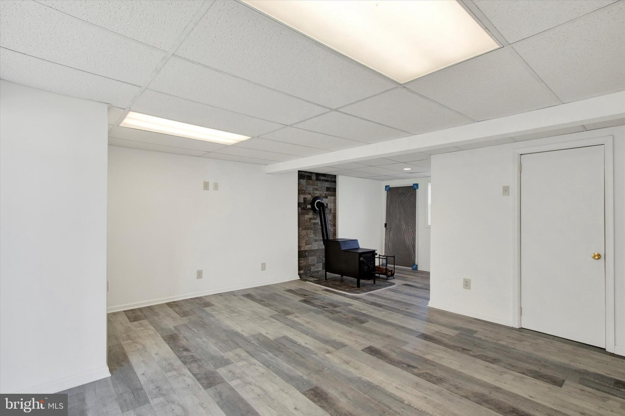 744 Tamarack Trail Reading, PA 19607 - Photo 18 of 27 a view of empty room with wooden floor and fan