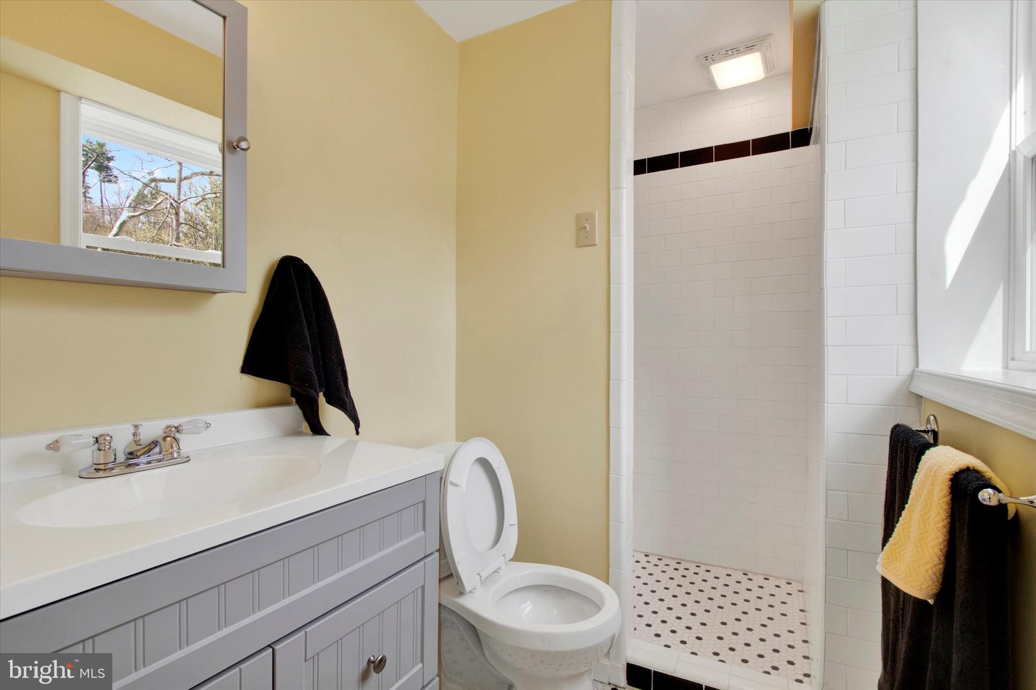 744 Tamarack Trail Reading, PA 19607 - Photo 21 of 27 a bathroom with a toilet and a shower curtain