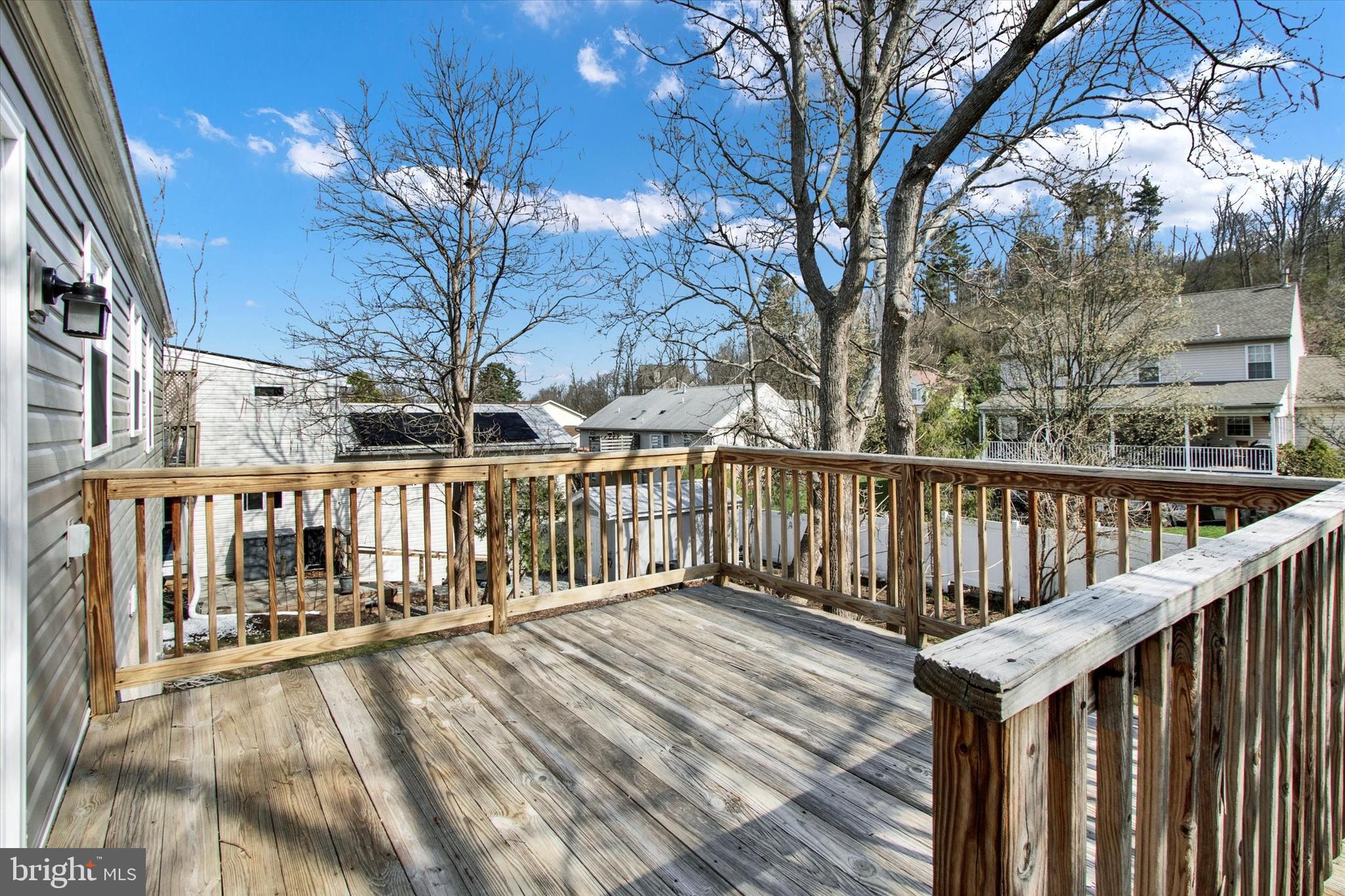744 Tamarack Trail Reading, PA 19607 - Photo 23 of 27 a porch with wooden floor and fence