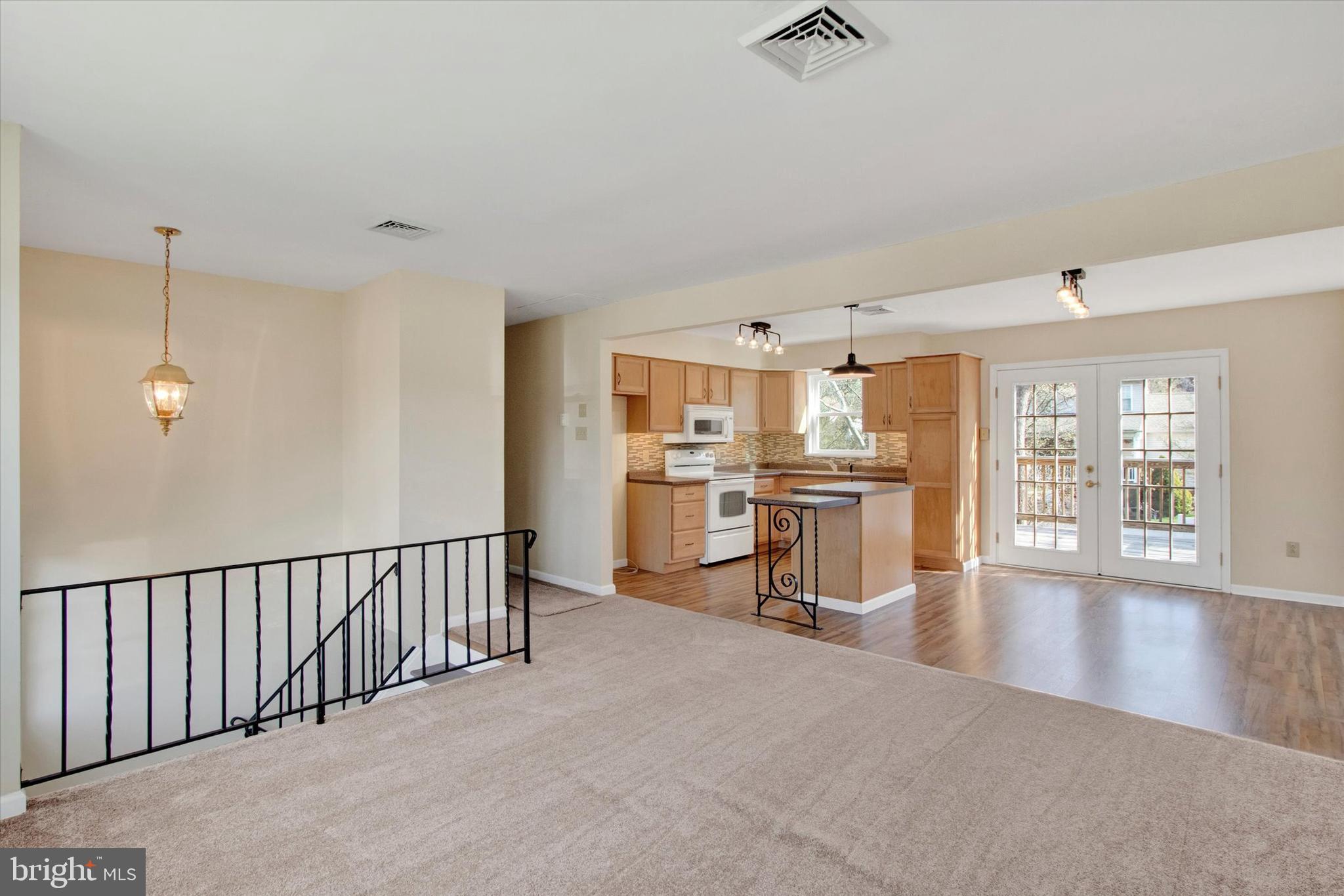 744 Tamarack Trail Reading, PA 19607 - Photo 3 of 27 a view of kitchen with furniture and wooden floor