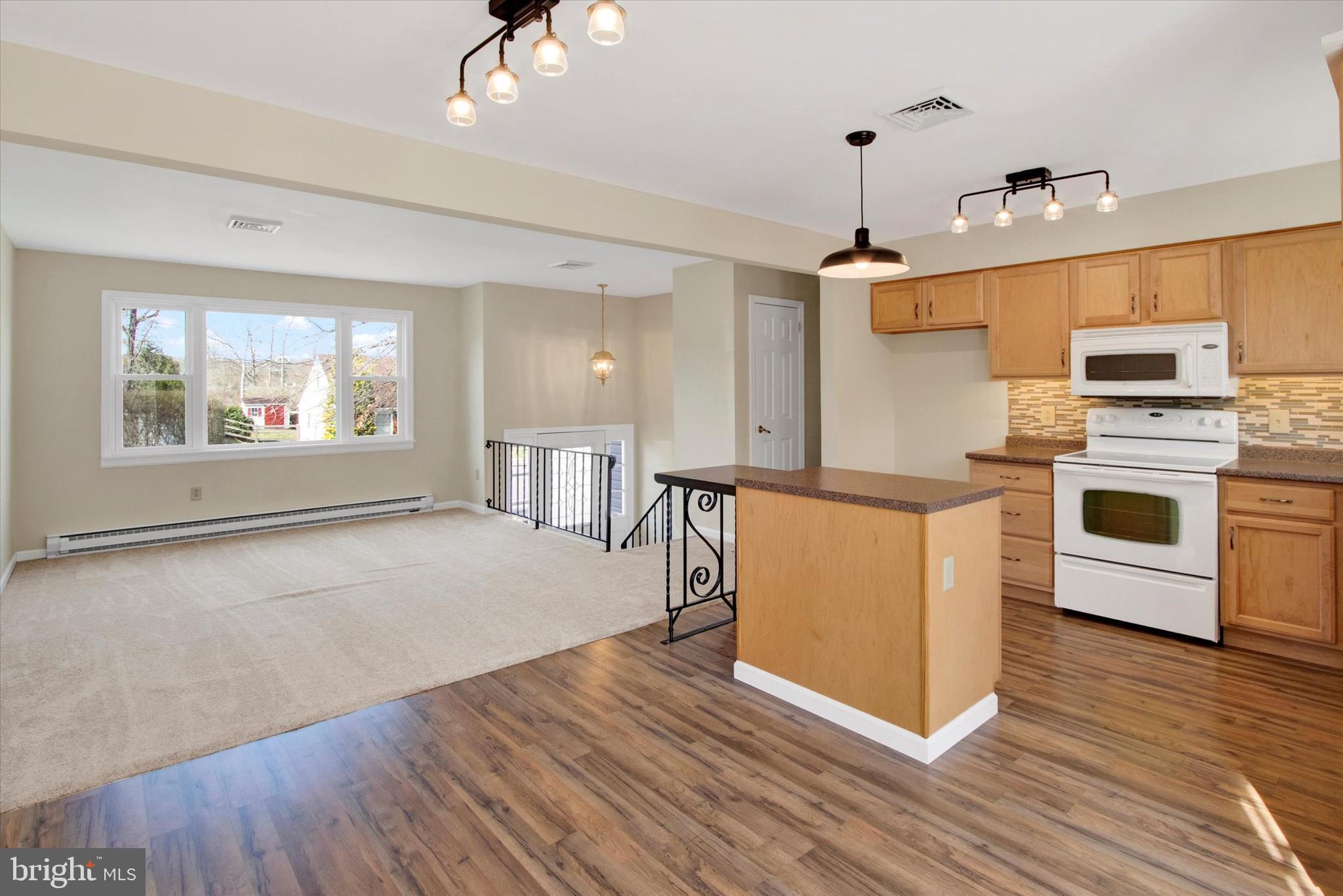 744 Tamarack Trail Reading, PA 19607 - Photo 6 of 27 a view of kitchen with sink microwave and stove