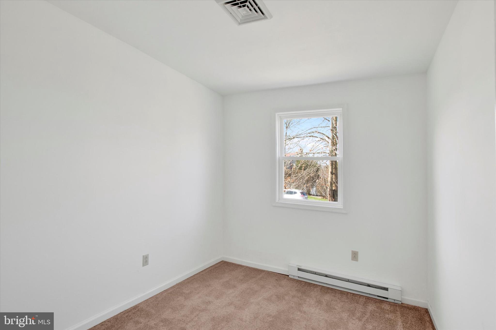 744 Tamarack Trail Reading, PA 19607 - Photo 8 of 27 an empty room with windows