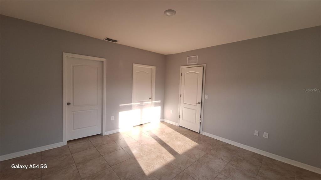 754 Chinoy Road Davenport, FL 33837 - Photo 3 of 26 a view of a room with natural light