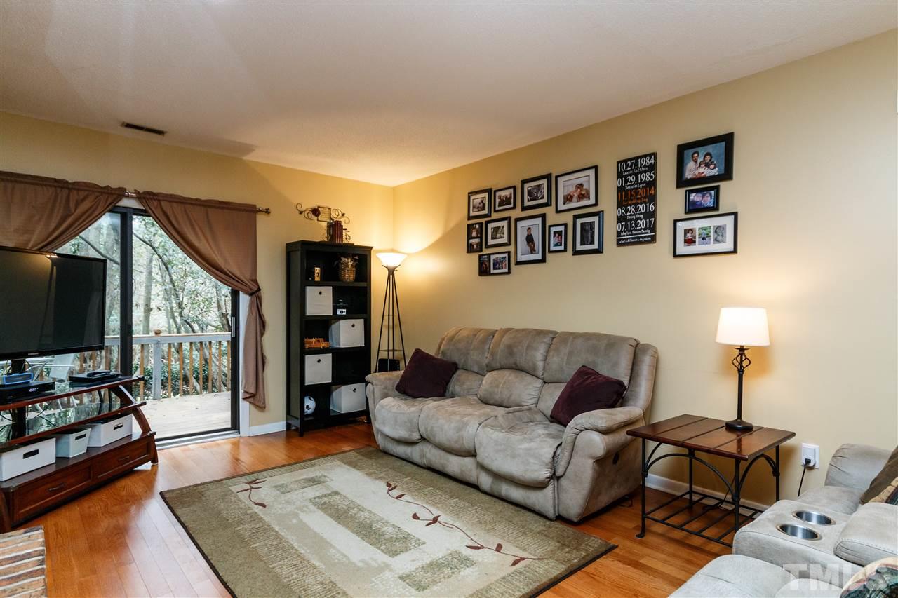 4411 Sunscape Lane Raleigh, NC 27613 - Photo 3 of 25 a living room with furniture and wooden floor