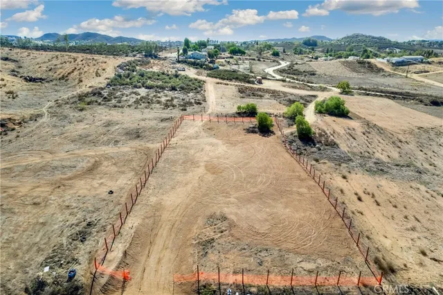 a view of a lake with beach and mountain view
