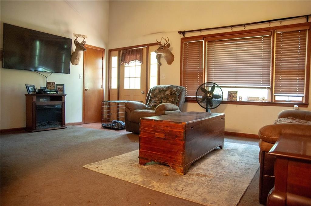 687 Bullcreek Road Butler, PA 16002 - Photo 11 of 19 a living room with furniture and a flat screen tv