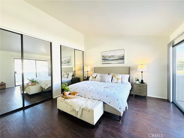 a bedroom with a bed and a couch