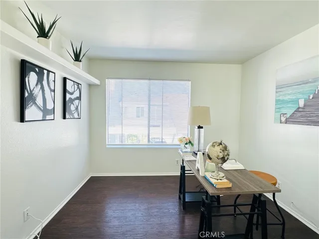 a view of a dining room with furniture and window