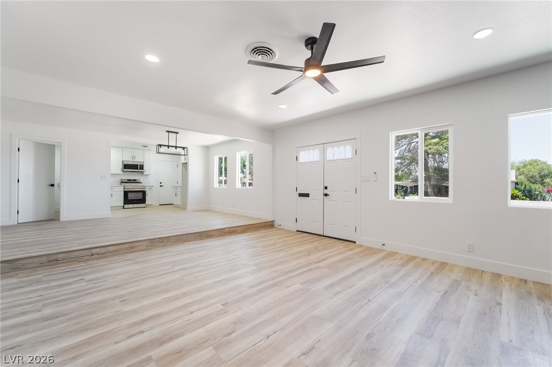 39 Lowery Street Henderson, NV 89015 - Photo 5 of 40 Natural light floods this inviting living space, offering an open concept flow to the adjacent kitchen.