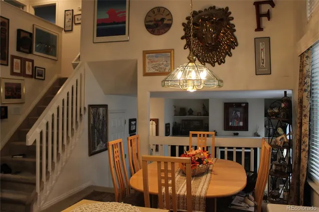 a view of a hallway with wooden floor and entryway