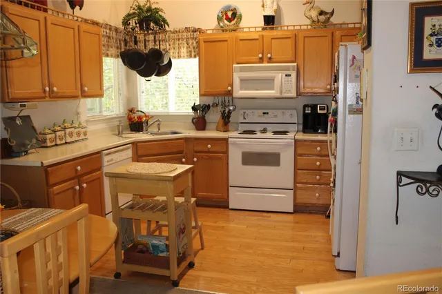a kitchen with a stove cabinets and a sink