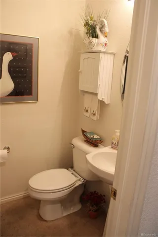 a bed room with a bed window and mirror