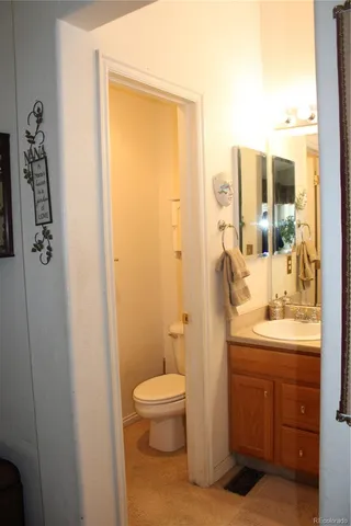 a bathroom with a granite countertop shower and a sink