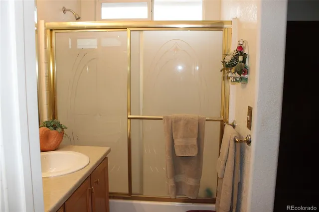 a bedroom with a bed and a table in it