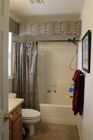 a kitchen with a sink and a refrigerator