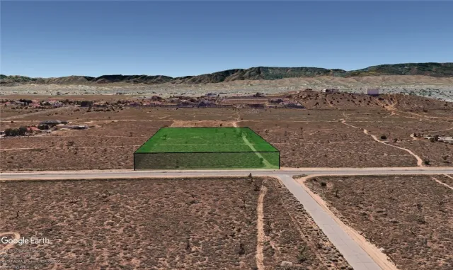 a view of a backyard with a mountain