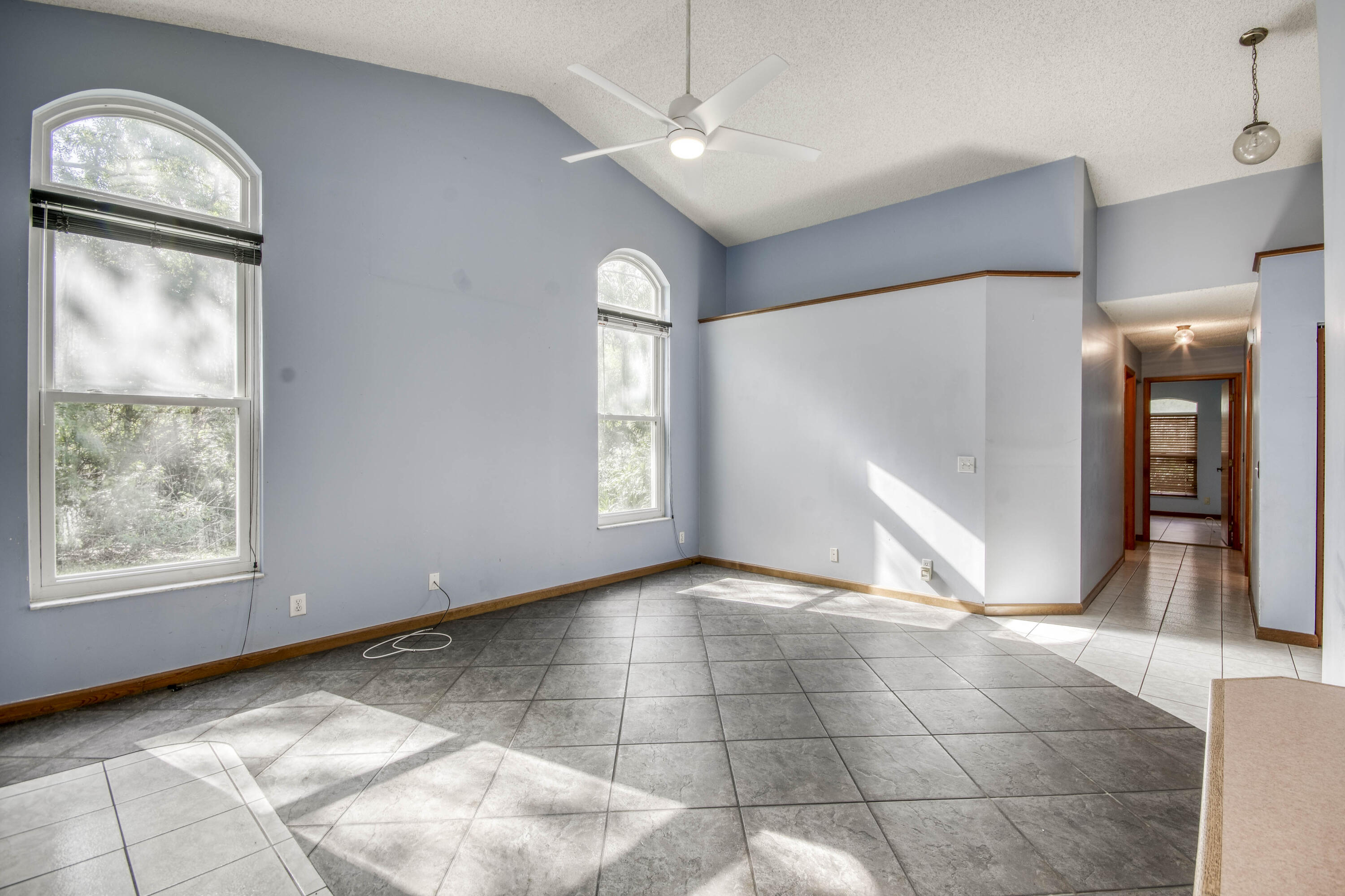 17862 123rd Terrace North Jupiter, FL 33478 - Photo 8 of 38 a view of an empty room with window and chandelier fan