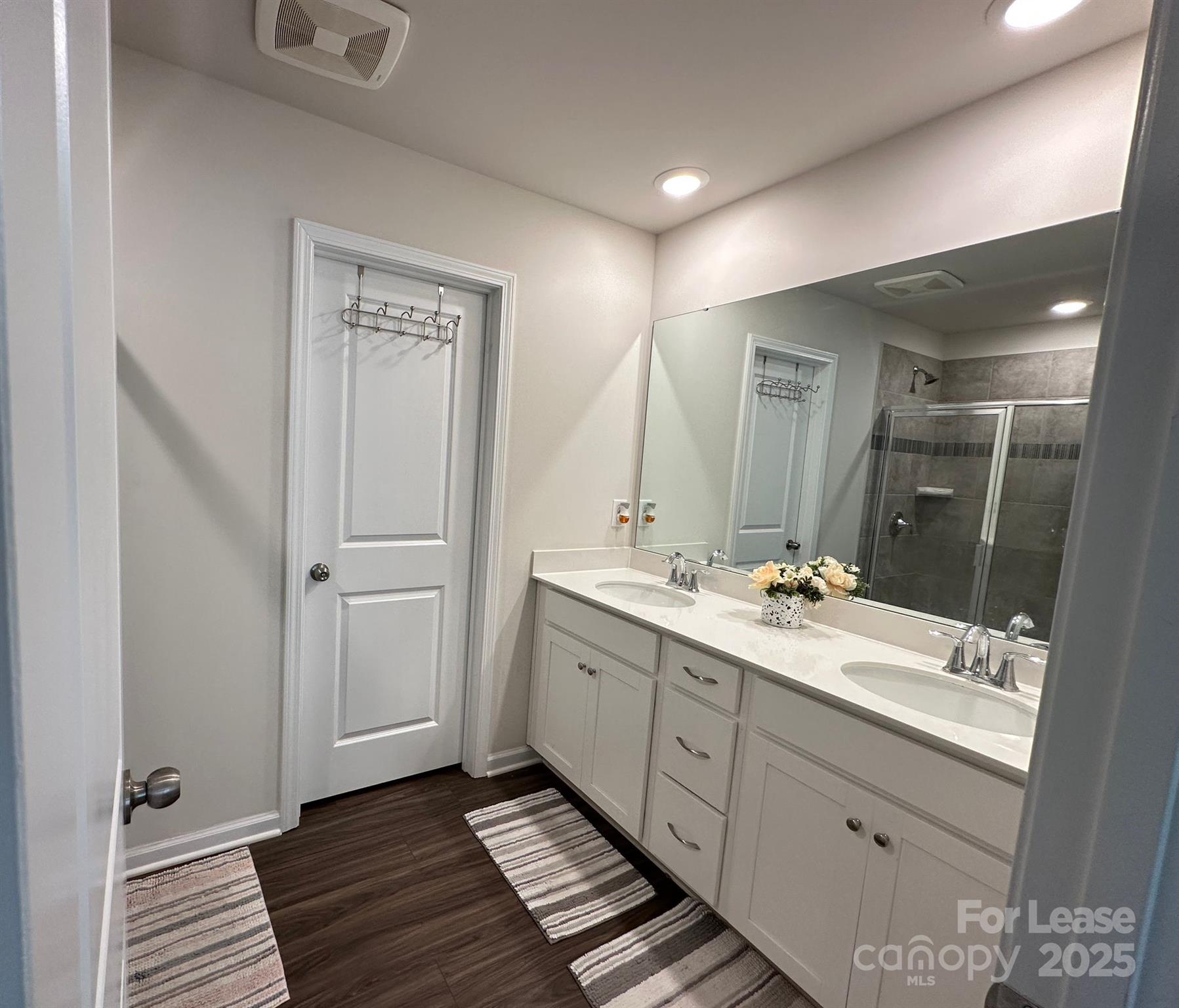 15619 Country House Street Charlotte, NC 28273 - Photo 16 of 19 a bathroom with a double vanity sink and mirror