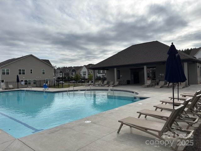 15619 Country House Street Charlotte, NC 28273 - Photo 3 of 19 a view of house with swimming pool and chair