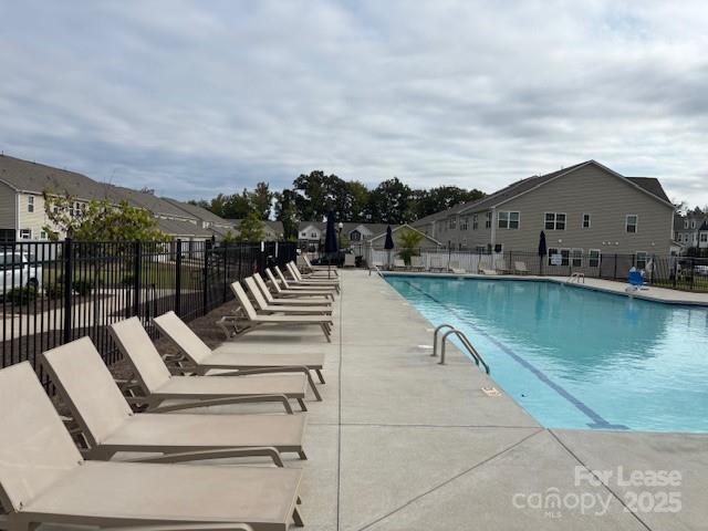 15619 Country House Street Charlotte, NC 28273 - Photo 4 of 19 a view of a swimming pool with a lounge chair