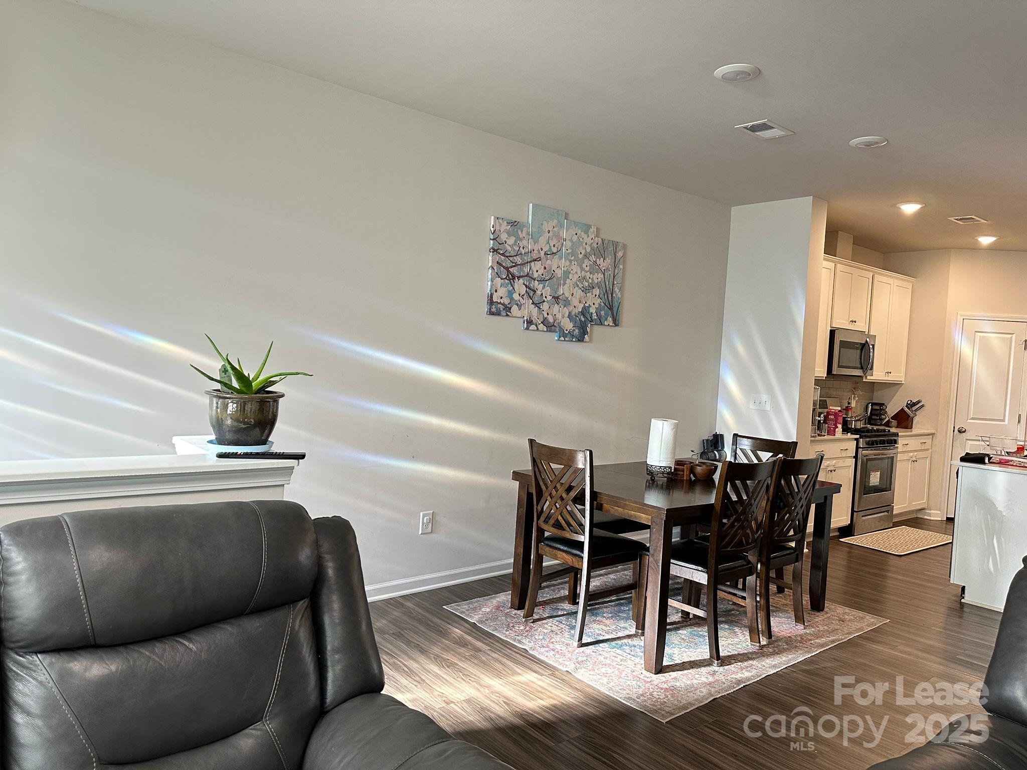 15619 Country House Street Charlotte, NC 28273 - Photo 9 of 19 a view of a dining room with furniture