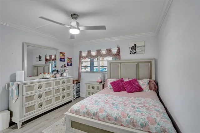 a bedroom with a bed and closet with window