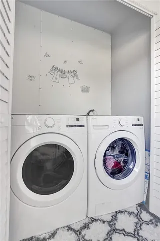 a utility room with dryer and washer