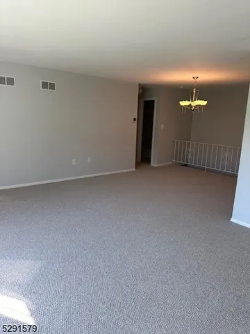 a view of a room with lamp and fan