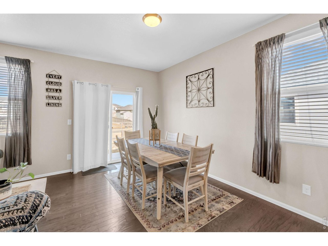 512 Buckrake Street Severance, CO 80550 - Photo 13 of 41 a view of a dining room with furniture and wooden floor