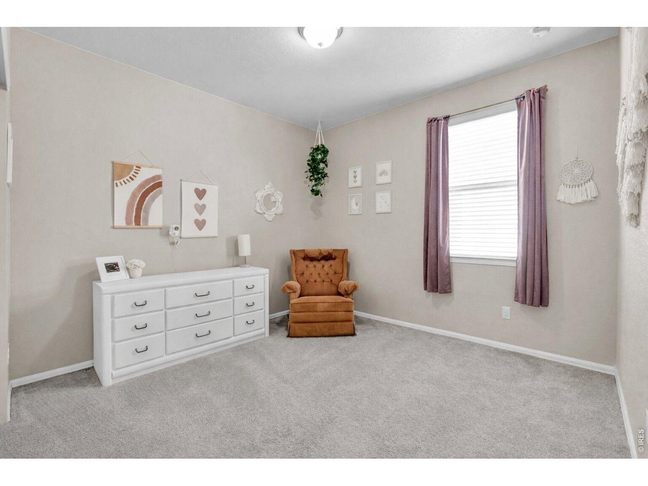 512 Buckrake Street Severance, CO 80550 - Photo 20 of 41 a bedroom with furniture and window