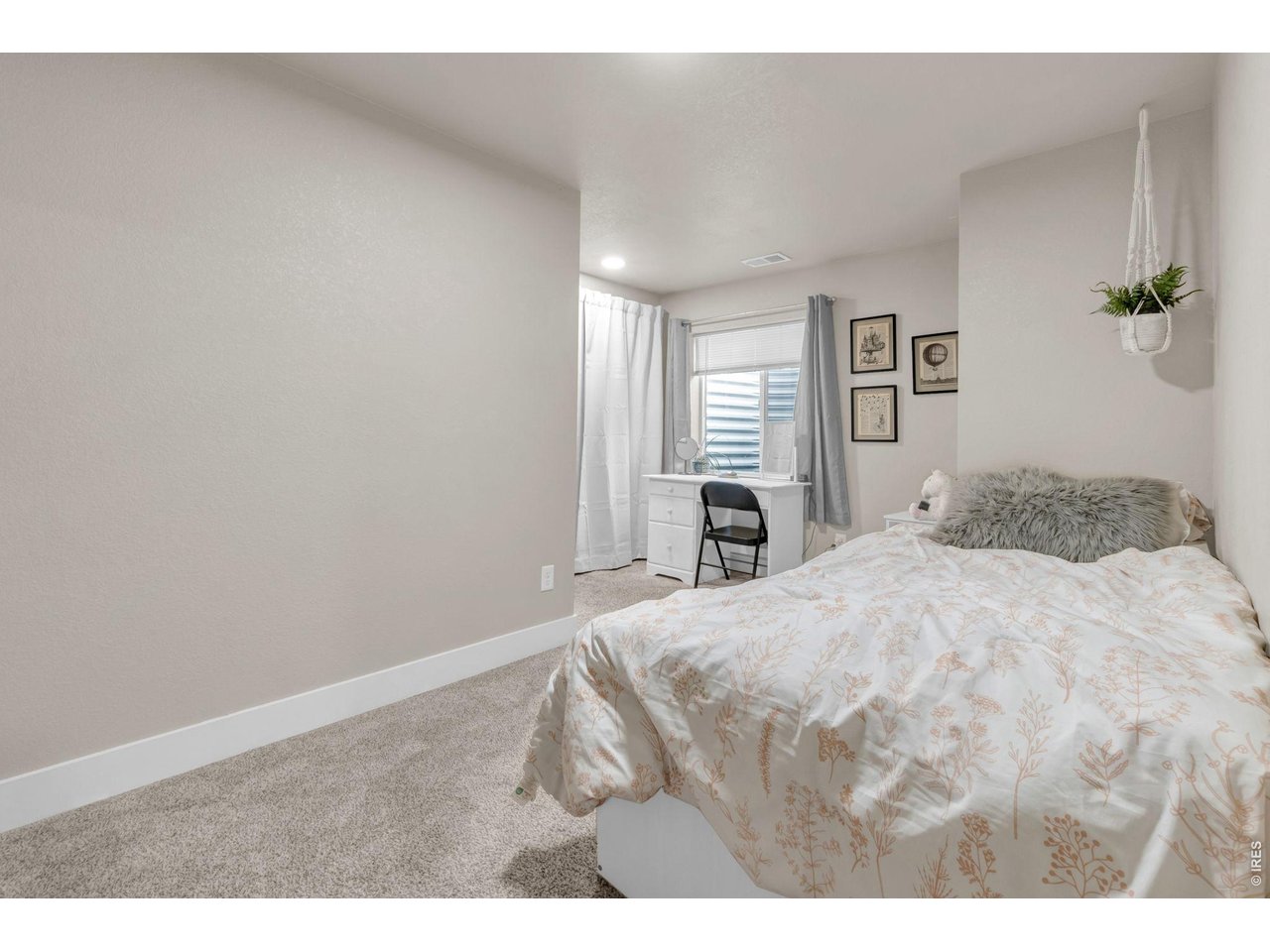 512 Buckrake Street Severance, CO 80550 - Photo 22 of 41 a bedroom with a bed and a cabinets