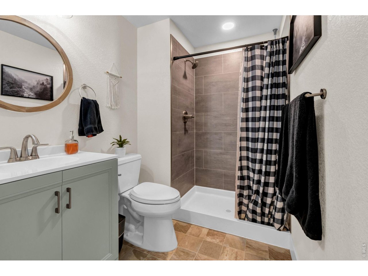 512 Buckrake Street Severance, CO 80550 - Photo 23 of 41 a bathroom with a shower toilet and sink
