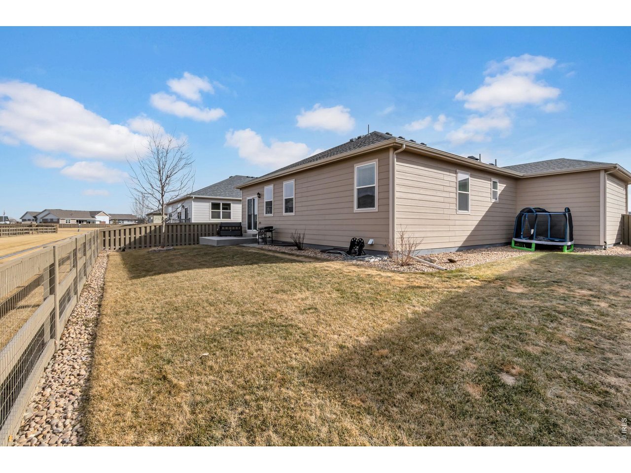 512 Buckrake Street Severance, CO 80550 - Photo 25 of 41 a view of a house with a yard