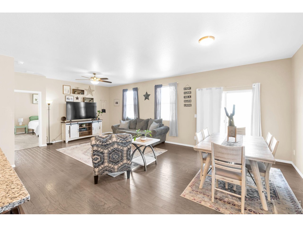 512 Buckrake Street Severance, CO 80550 - Photo 3 of 41 a living room with furniture and a wooden floor