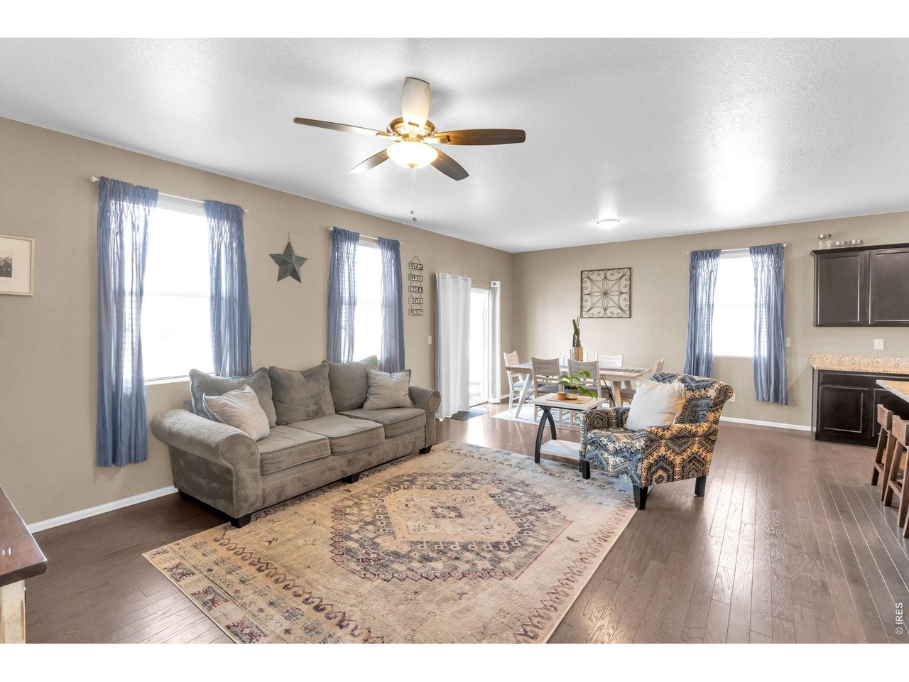 512 Buckrake Street Severance, CO 80550 - Photo 8 of 41 a living room with furniture and a chandelier