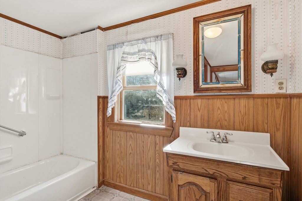 1601 Westover Road Chicopee, MA 01020 - Photo 15 of 32 a bathroom with a sink a bathtub and a shower