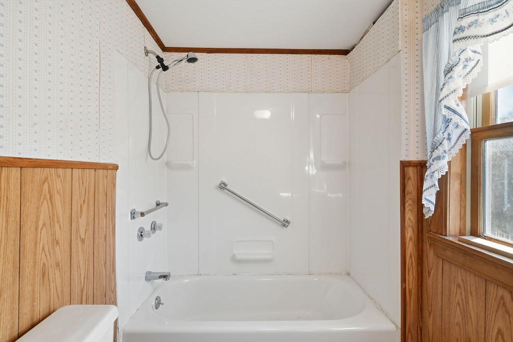 1601 Westover Road Chicopee, MA 01020 - Photo 16 of 32 a bathroom with a bathtub and a shower