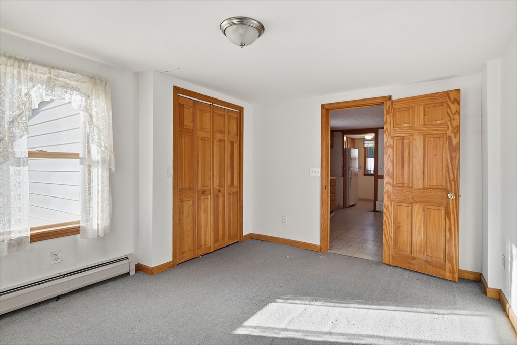 1601 Westover Road Chicopee, MA 01020 - Photo 19 of 32 a view of an empty room with closet and a window