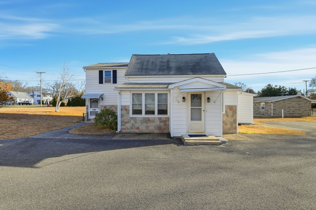 1601 Westover Road Chicopee, MA 01020 - Photo 2 of 32 front view of a house with a swimming pool