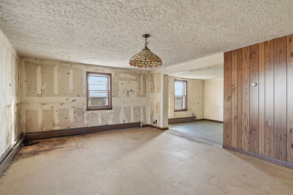 1601 Westover Road Chicopee, MA 01020 - Photo 25 of 32 wooden floor in an empty room with a window