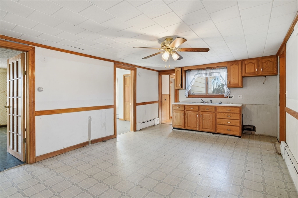 1601 Westover Road Chicopee, MA 01020 - Photo 8 of 32 a view of a kitchen with a sink cabinets and window